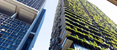 Low angle view of apartment building with vertical garden, sky background with copy space, Green wall-BioWall or living wall is a wall covered with living plants on residential tower in sunny day, Sydney Australia.